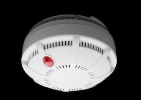 Smoke and fire detector part of fire alarm system isolated on black