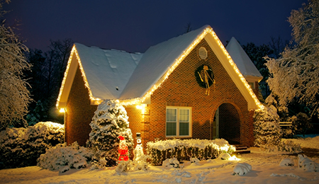 house in the winter time with christmas lights and decorations displaying signs of good home security-10-25