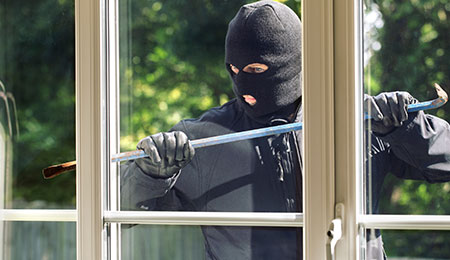 Burglar trying to break into house with a home security monitoring system-MP-2-25