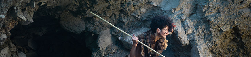 cavewoman protecting her home security with a spear