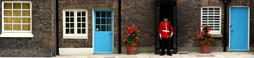 guard standing watch over a house as an old form on home security