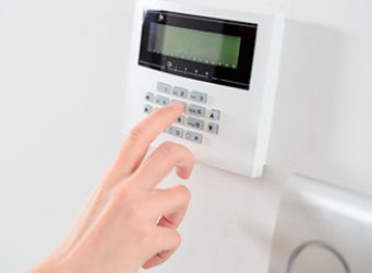 Person Setting a Burglar Alarm