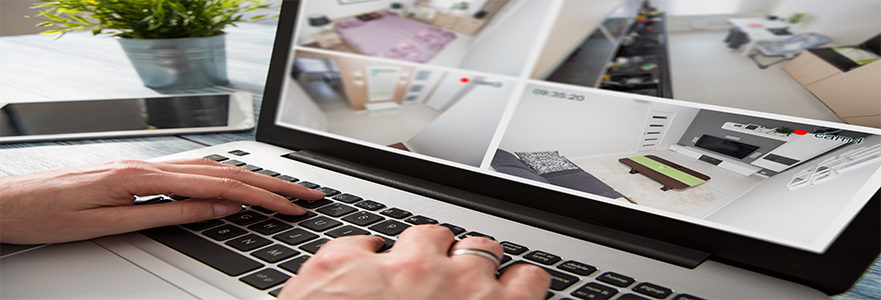 Man-monitoring-his-home-via-laptop