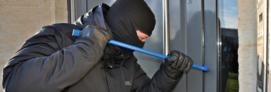 Package delivery person using a home intercom system at the front door - Moore Protection